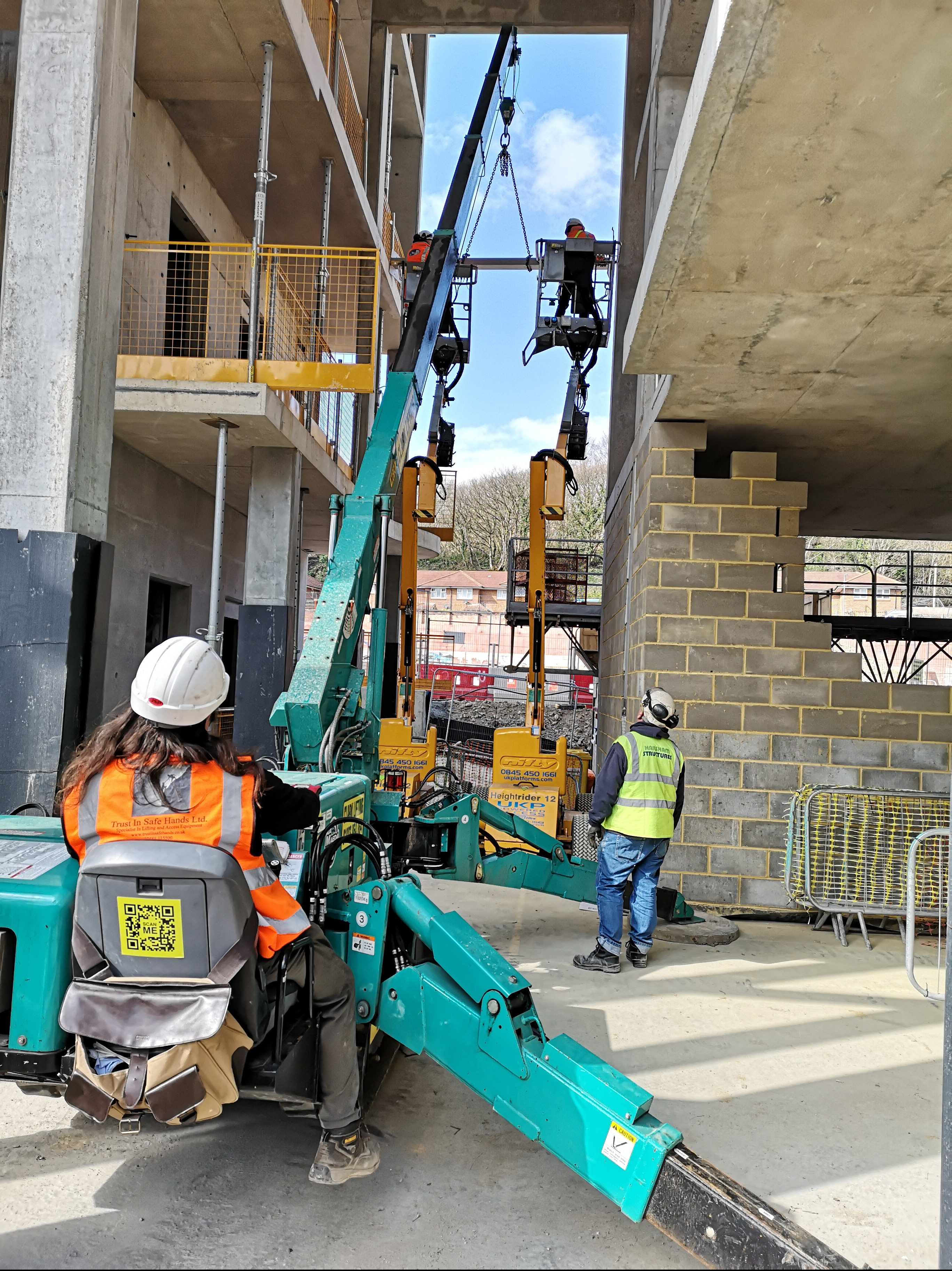 Spider crane used to install steel beams to concrete frame under the slab over.